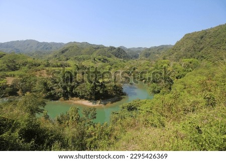 Beautiful nature of Guatemala. Green hills everywhere, jungle and the blue tiver