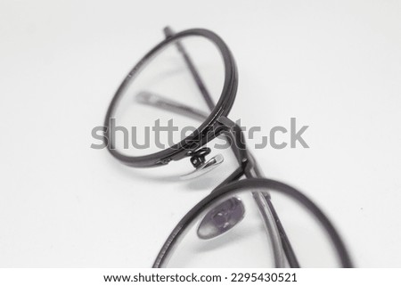 isolated photo of minus glasses with black frames on a white background