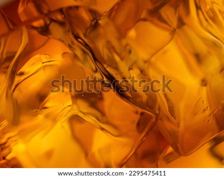Whisky on the rocks, glass filled with ice cubes, close-up shot Royalty-Free Stock Photo #2295475411