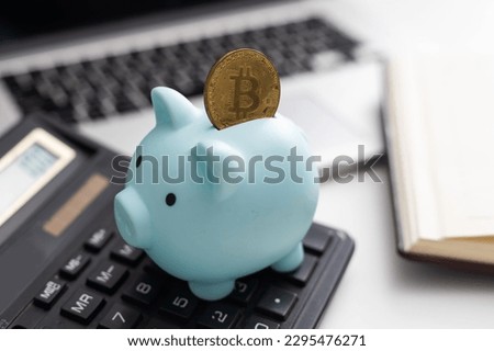 bitcoin on piggy bank at office