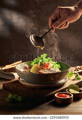 hot Vietnamese Phở  with sauces Royalty-Free Stock Photo #2295480955