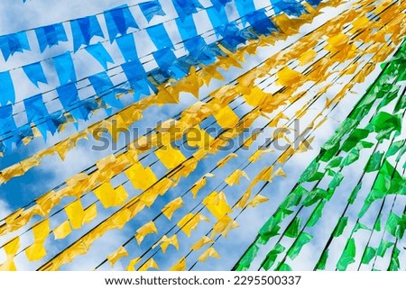 Decoration colorful flags. Against blue sky.