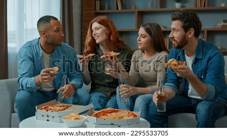 Group of friends colleagues eat pizza talk happy diverse women and men drink beer celebrate event party guys and girls meeting in living room order lunch food delivery at home multiracial friendship Royalty-Free Stock Photo #2295533705