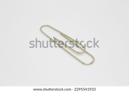 isolated photo of metal clip or paperclip on white background