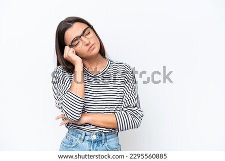 Young caucasian woman isolated on white background with tired and bored expression