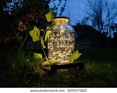 glowing boho led jars in the garden