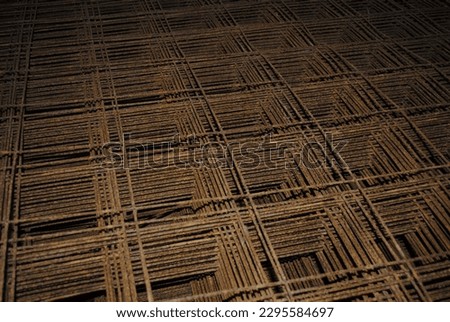 Stack of metal grates for housing foundation concrete pour close up abstract building materials