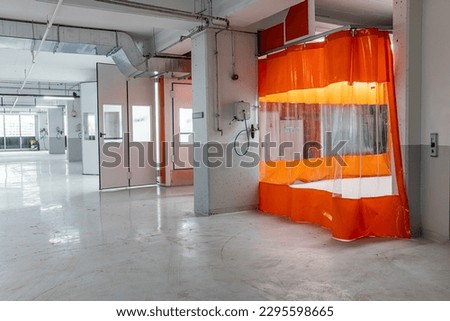 Car service concept. Spray paint cabinet for car body or vehicles painting or parts in a car repair station. Paint booth repair station.  Royalty-Free Stock Photo #2295598665