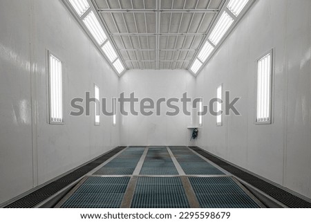 Car service concept. Spray paint cabinet for car body or vehicles painting or parts in a car repair station. Paint booth repair station.  Royalty-Free Stock Photo #2295598679