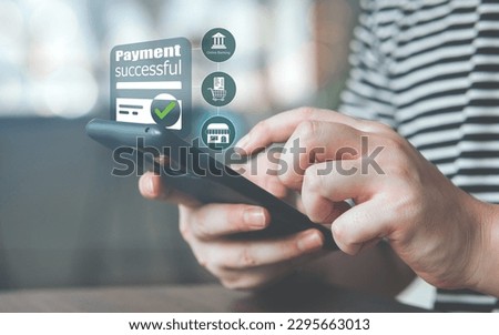 online financial transactions and successful payment. Close-up view of hand using smartphone for payment of online shopping transaction By paying through online banking.