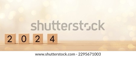 2024 on wooden table. 2024 New Year. Wooden blocks 2024 on neutral grey background. Start new year 2024 with goal plan, goal concept, action plan, strategy, new year business vision.