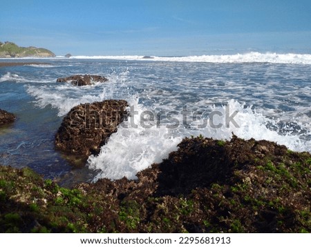 waves crashing against the rocks