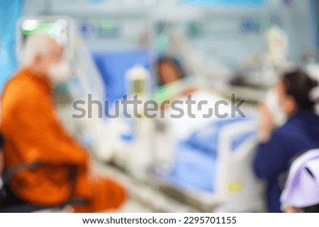 Brightly sunlit emergency roon with working personnel, unfocused background.

Doctors in the ward. Medical blurred background
