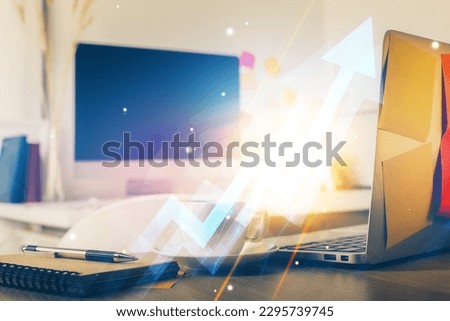 Computer on desktop with point up arrows hologram. Double exposure. Concept of success. Royalty-Free Stock Photo #2295739745