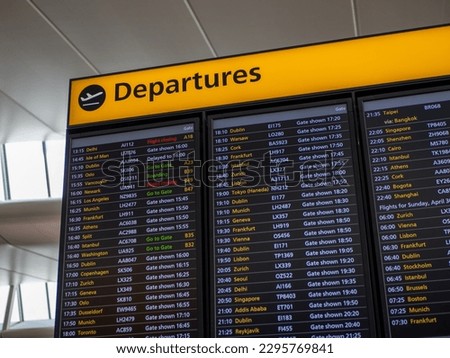 airport departure sign is essential for travelers as it displays important flight information such as gate numbers, boarding times, and flight statuses. This sign helps ensure smooth travel experience Royalty-Free Stock Photo #2295769841