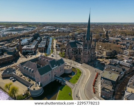 This aerial drone picture shows the city center and church in Woerden, a town in Zuid-Holland, the Netherlands. Next to the church there is a castle. 