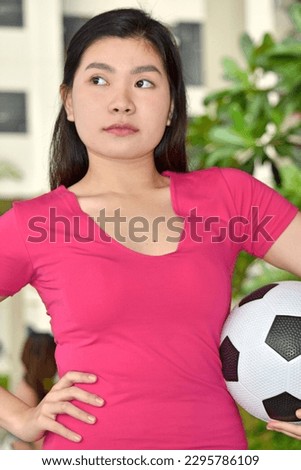 An Unemotional Asian  Fitness Person Royalty-Free Stock Photo #2295786109