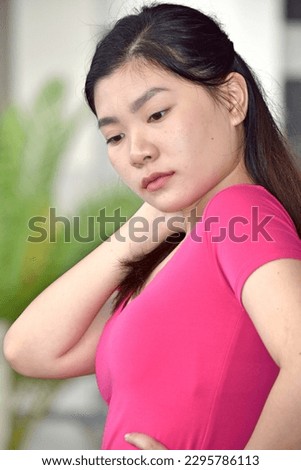 An Unemotional Chinese Asian Person Royalty-Free Stock Photo #2295786113