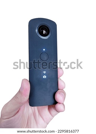 ultra-thin 360-degree camera in hand, close-up, cut-out                           