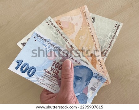 Many Turkish Lira Banknotes with coins on wooden desk. money banknotes pack. Closeup
