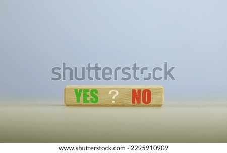 wooden block yes or no symbol and checkmark  Alternative concepts, decision making, and true and false test questions.