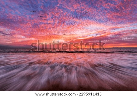 A Beautiful Ocean Sunset With A Wave Breaking On Shore High Resolution