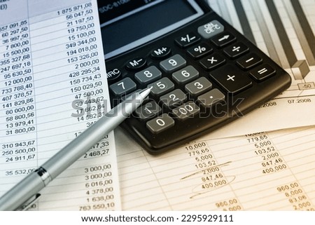 Items for accounting and business in the office on the table.