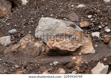Characteristics of volcanic rock and gravel in the form of basaltic andesite and basalt above the ruins of the slopes of the mountain