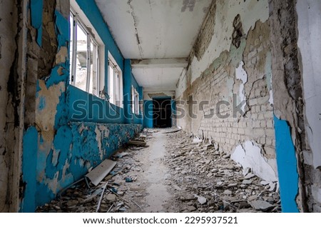 inside a destroyed school in war Ukraine Royalty-Free Stock Photo #2295937521