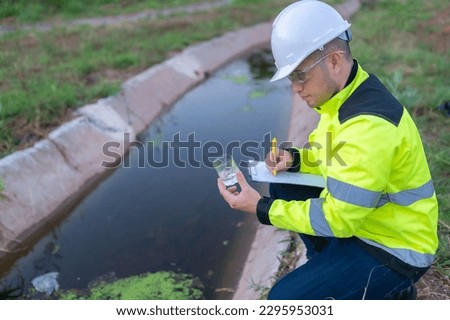 Environmental engineers inspect water quality,Bring water to the lab for testing,Check the mineral content in water and soil,Check for contaminants in water sources. Royalty-Free Stock Photo #2295953031