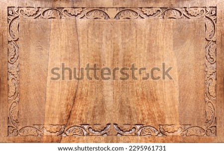 Horizontal background with wood carving floral ornament. Decorative carved border on wooden surface. Mock up template. Copy space for text Royalty-Free Stock Photo #2295961731