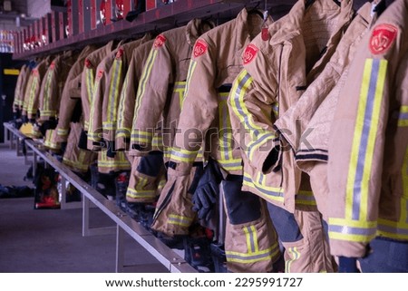 dutch uniforms of firefighters in fire station Royalty-Free Stock Photo #2295991727