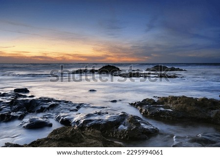 A rocky beach of Palmachim Israel during the sunset 