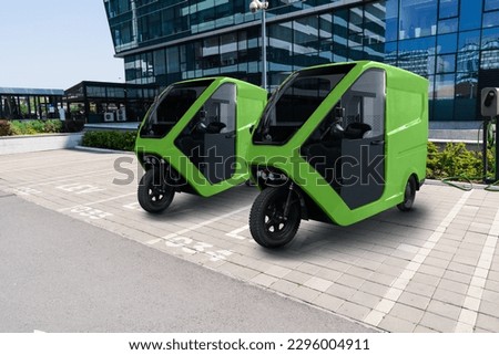Electric tricycle scooters on a parking lot for LEV - light electric vehicles Royalty-Free Stock Photo #2296004911