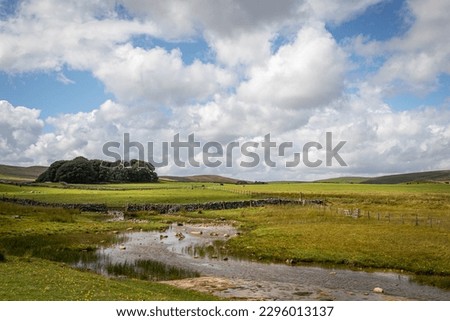 Landscape photo with hills and river 