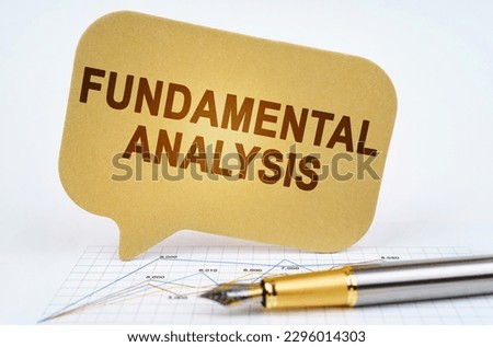 Business concept. On the business diagram is a pen and a sign with the inscription - FUNDAMENTAL ANALYSIS Royalty-Free Stock Photo #2296014303