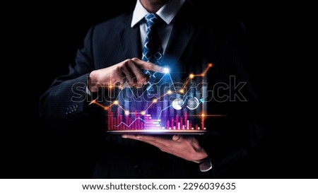 Businessman analyst working with digital finance business data graph showing technology of investment strategy for perceptive financial business decision. Digital economic analysis technology concept. Royalty-Free Stock Photo #2296039635