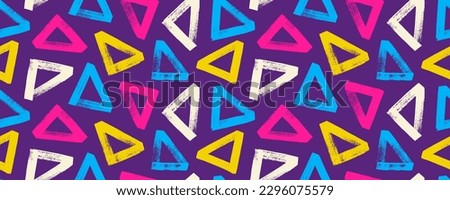 Colorful geometric seamless pattern with bold triangles. Geometric abstract texture, horizontal vector bright color banner. Brush drawn grunge triangles with rough edges and dry texture. Trendy design