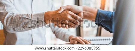 Business people colleagues shaking hands during a meeting to sign agreement for New Partner Planning Strategy Analysis Concept Royalty-Free Stock Photo #2296083955