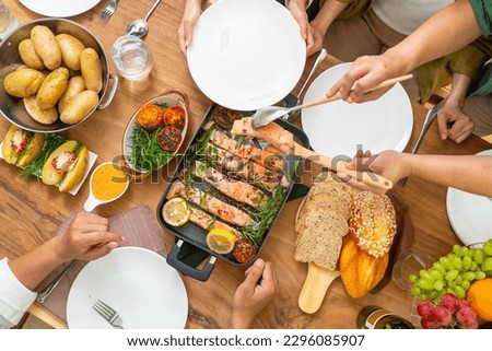 Top view Group of Happy Asian people friends enjoy celebration dinner party sharing and eating food with drinking wine together at home. Adult man and woman reunion meeting event on holiday vacation. Royalty-Free Stock Photo #2296085907