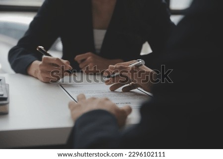 Close up view of job interview in office, focus on resume writing tips, employer reviewing good cv of prepared skilled applicant, recruiter considering application, hr manager making hiring decision Royalty-Free Stock Photo #2296102111