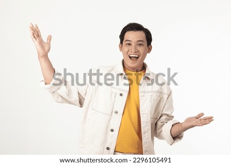 Portrait of a young Asian handsome adult male student, excited and show the expression with hand gesture.