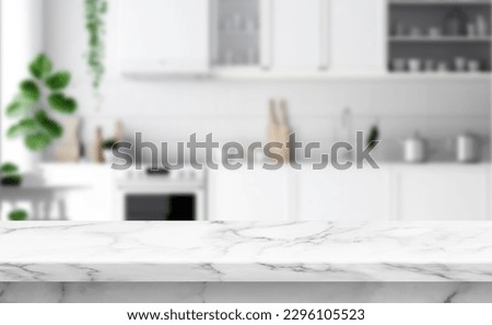 Close up photo of contemporary kitchen island with marble table top with kitchen blurry loose focal background Royalty-Free Stock Photo #2296105523