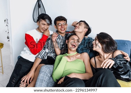 Young latin LGBT friends portrait celebrating gay pride month at home in Mexico, Hispanic homosexual people from lgbtq community in Latin America Royalty-Free Stock Photo #2296134997