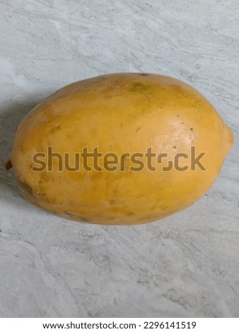 Papaya fruit that is orange and yellow