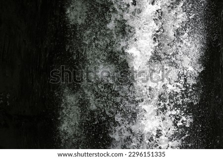 jet stream of water in a waterfall detal abstract background