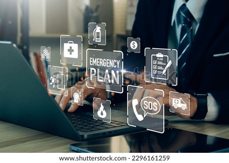 Concept of Emergency Preparedness Plan.Businessman touching Emergency Plan icon to learn and prepare in emergency situation .Business Evacuation Training concept. Royalty-Free Stock Photo #2296161259