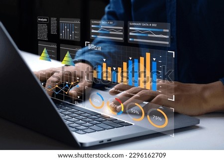 Analyst Works on Personal Computer Showing business analytics dashboard with charts, metrics and KPI to analyze performance and create insight reports for operations management. Data analysis concept. Royalty-Free Stock Photo #2296162709
