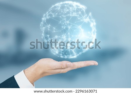 Close up of businessman hand holding glowing blue polygonal globe on blurry office interior background. Global technology and metaverse concept