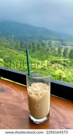 Sipping it while enjoying a breathtaking mountain view creates a perfect sensory experience. The smooth and creamy latte complements the crispness of the cold ice and the stunning natural scenery.